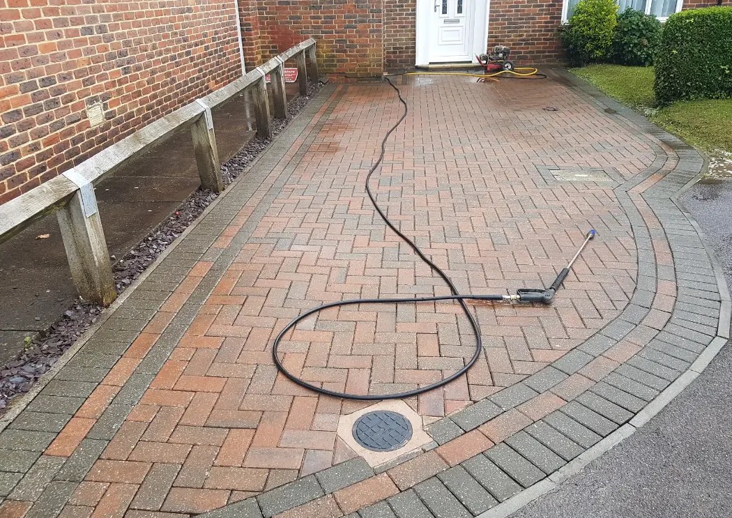 Block paved driveway after it has been pressure cleaned in Crawley