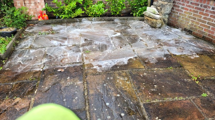Soft washing natural sandstone patio in Pound Hill Crawley